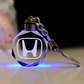 Llavero con logotipo automovilístico en 3D de cristal