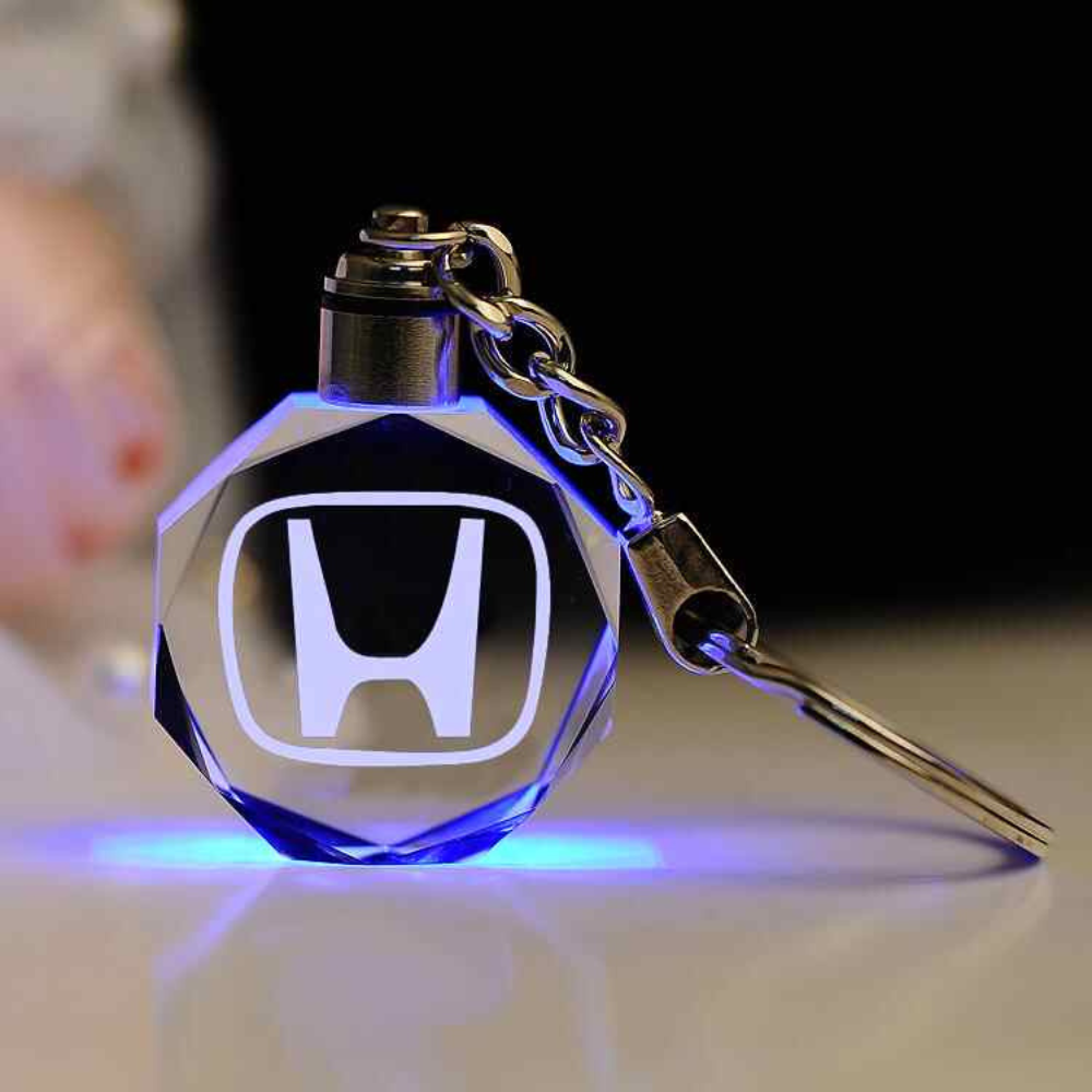 Llavero con logotipo automovilístico en 3D de cristal